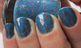 Raptor Girl Nail Polish - azure blue with orange and warm toned glitter - Fanchromatic Nails